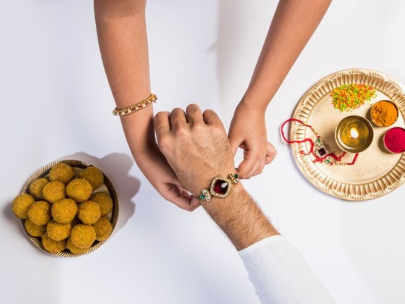 Catchy Raksha Bandhan Captions for Social Media Posts Wordsmithh Blog Raksha Bandhan Instagram Post with Siblings and Festive Background