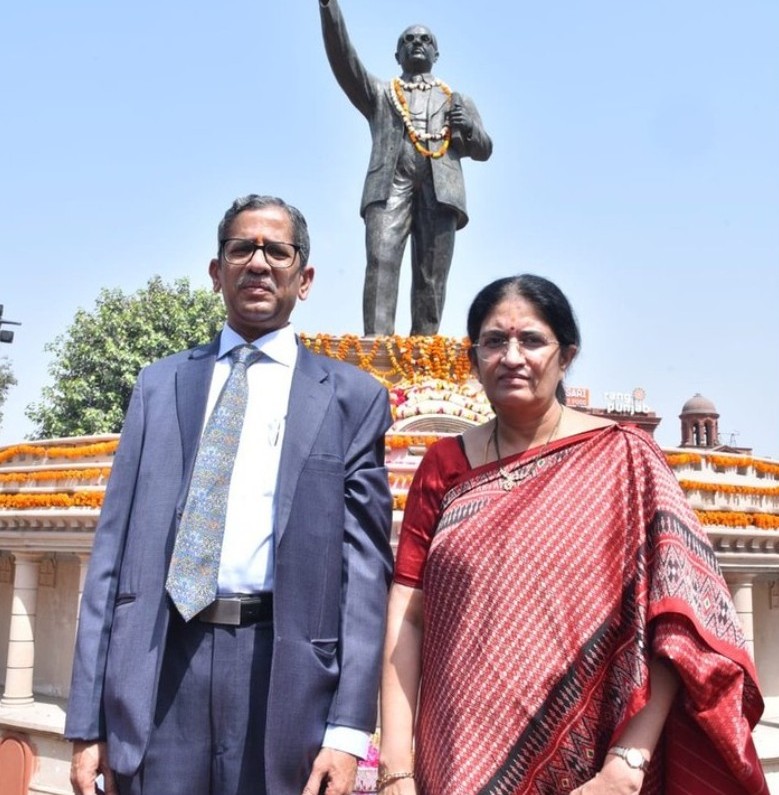 Two People Paying Tribute to Dr BR Ambedkar on Ambedkar Jayanti Wordsmithh Blog Two Individuals Standing Respectfully in Front of a Statue of Dr Br Ambedkar During Ambedkar Jayanti Celebrations